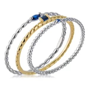 Set da 3 anelli bicolore Morellato in acciaio con pietre blu. Design moderno ispirato allo stile anni ’30, perfetto per ogni occasione.